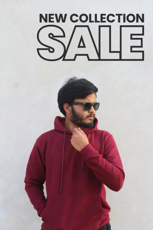 A man wearing a maroon hoodie and sunglasses, striking a stylish pose against a light neutral background. The text 'New Collection Sale' is prominently displayed above, highlighting the promotion.