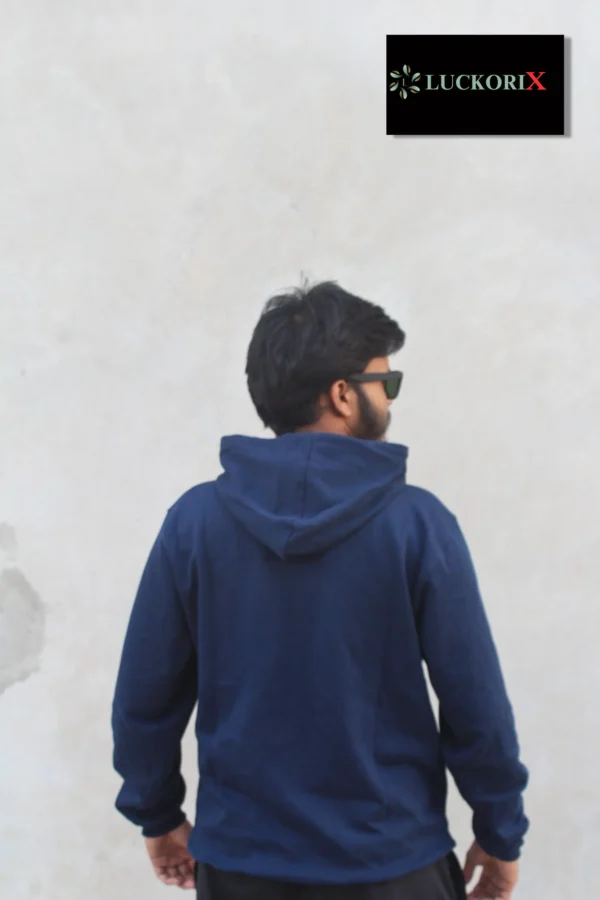 Back view of a man wearing a navy blue hoodie from LuckoriX, showcasing its minimalistic design and comfortable fit.