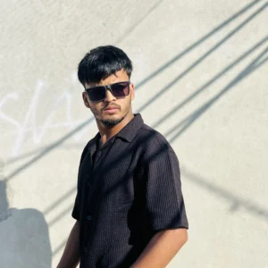"Man wearing a black textured short sleeve button-up shirt by LuckoriX, styled with sunglasses and a watch"