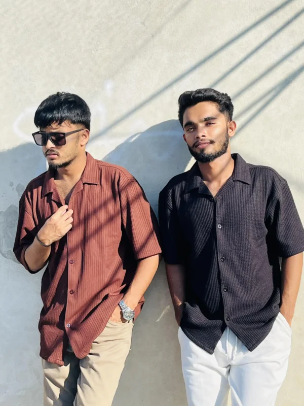 "Two men wearing LuckoriX textured shirts in brown and black, showcasing stylish casual fashion in sunlight"